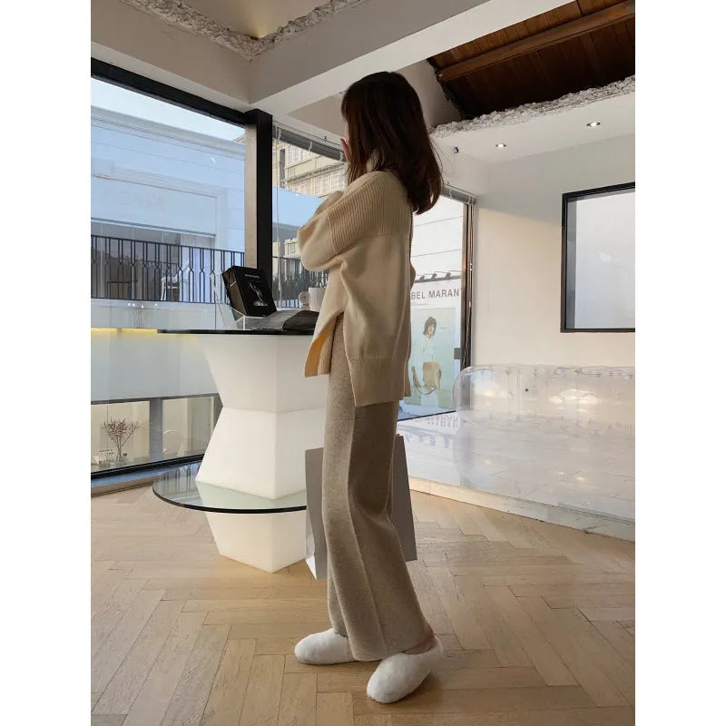 Women's high-waisted wide-leg knitted trousers in cream white, casual autumn winter style.