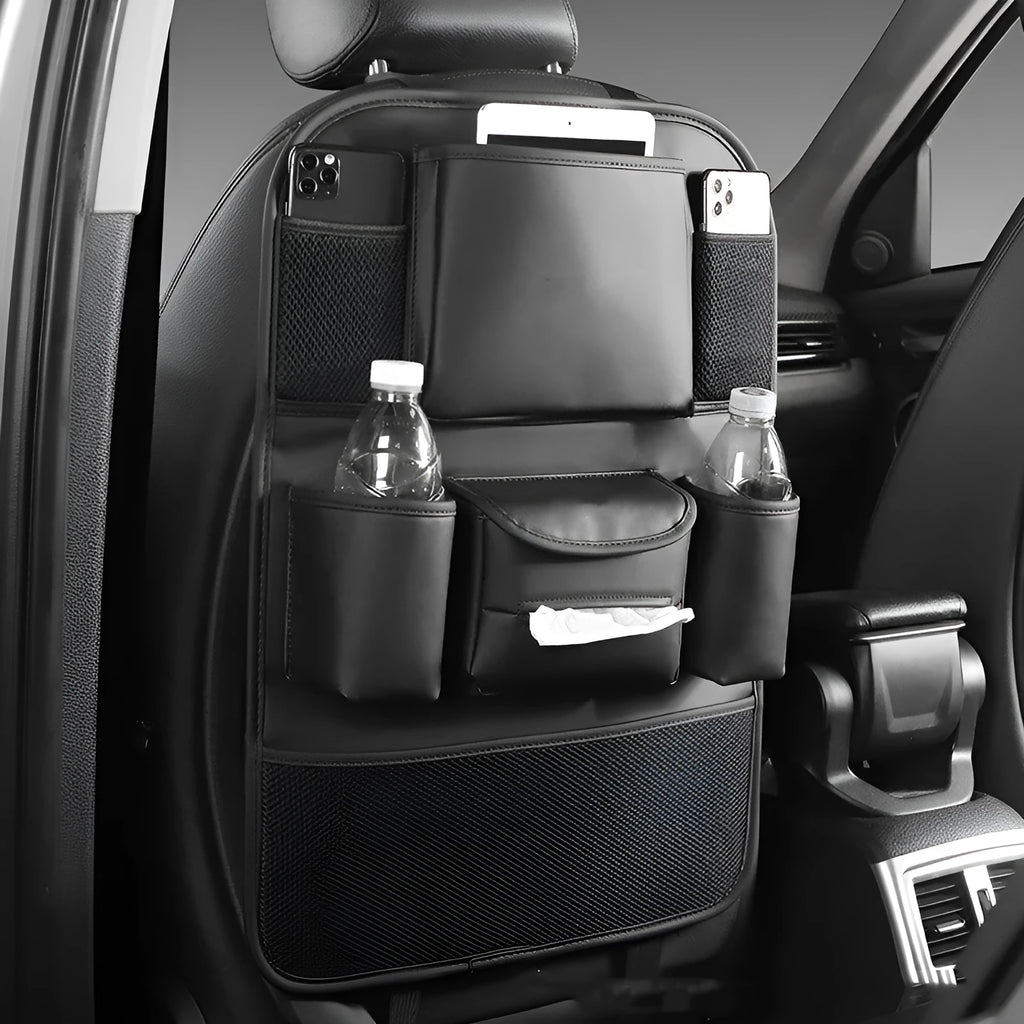 Leather car seat back storage bag hanging from vehicle headrest with multiple compartments