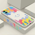 White TPU iPhone case with rainbow smiley face design and attached lanyard