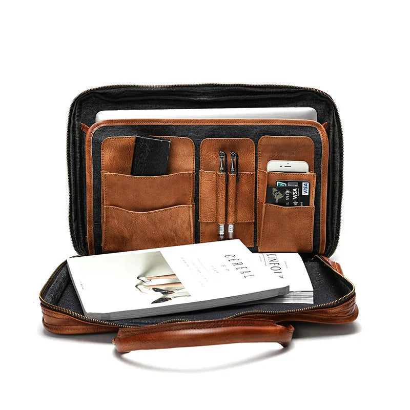 Large vintage leather men's briefcase showing internal laptop, document, camera, and phone compartments
