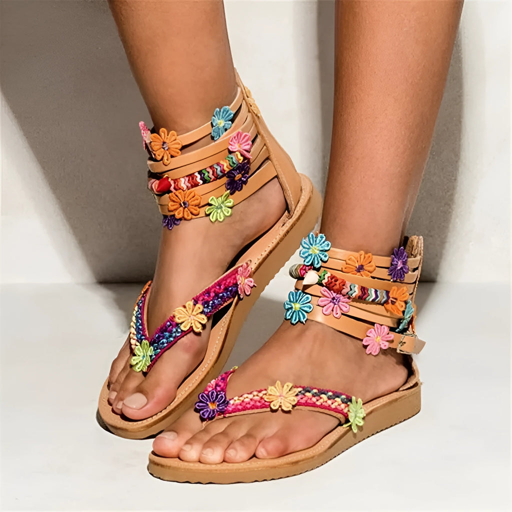 Women's ethnic Roman sandals with floral beaded petal details on a PU upper, round toe.