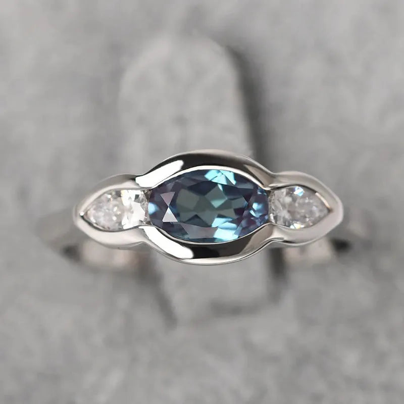 Geometric ellipse copper ring with inlaid zircon stones in white gold colour finish