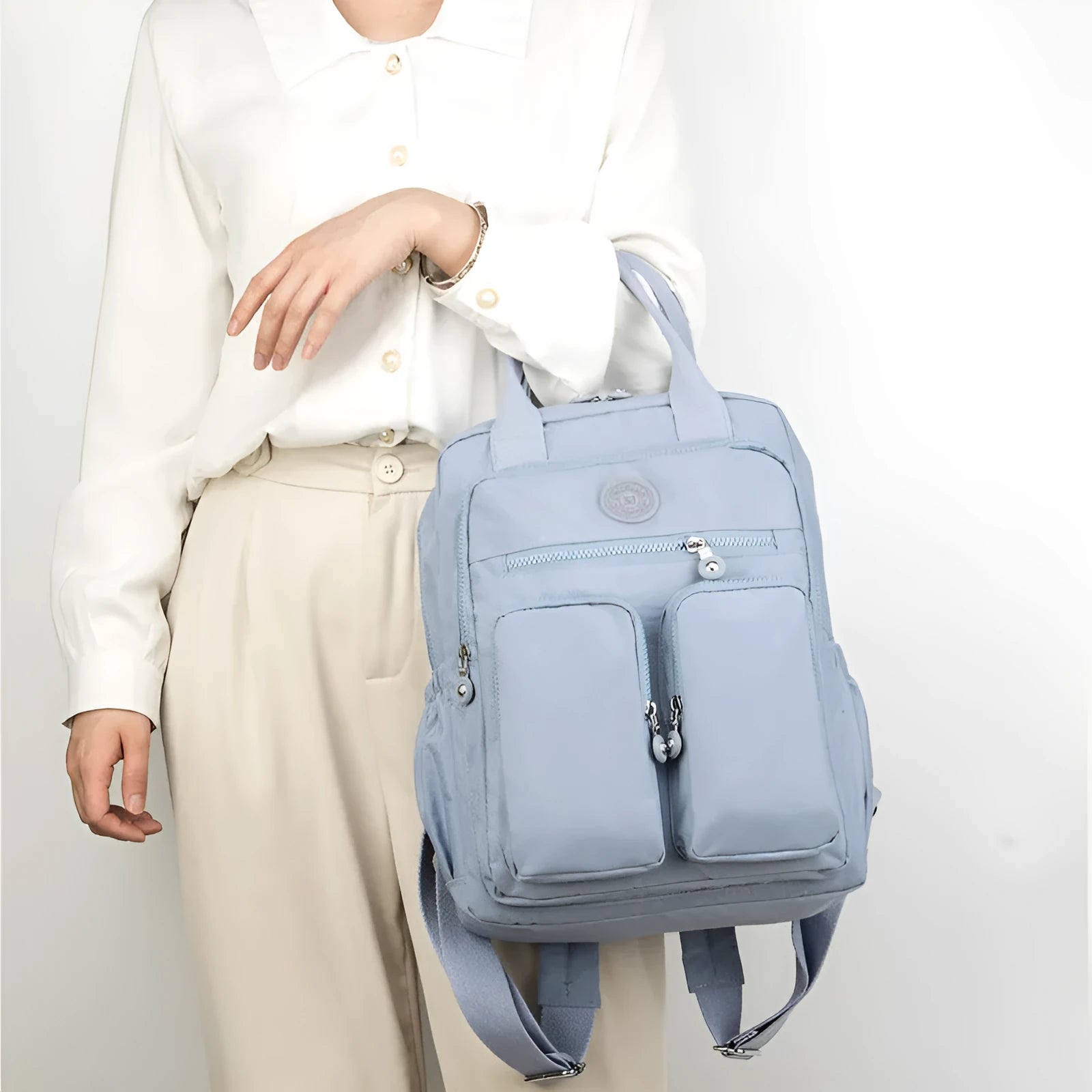 Waterproof nylon travel backpack in lotus root purple colour, showing multiple internal compartments and an external 3D pocket.