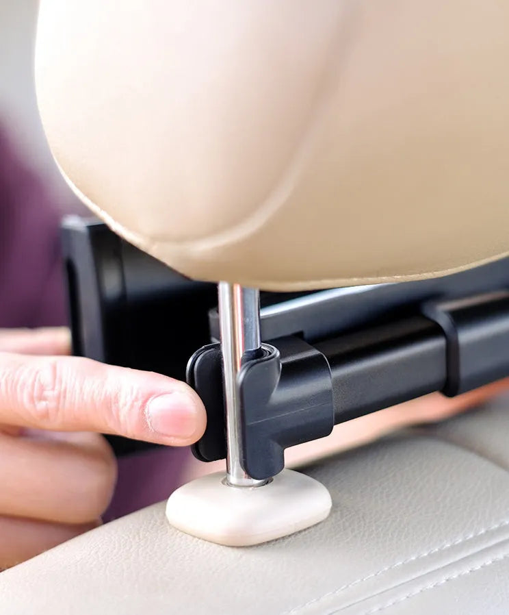 Black car phone holder mounted to rear seat base holding tablet for navigation