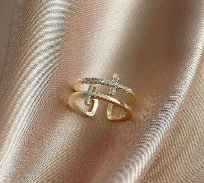 Adjustable double cross geometric ring in white gold colour with zircon stones in a sterling silver inlay.