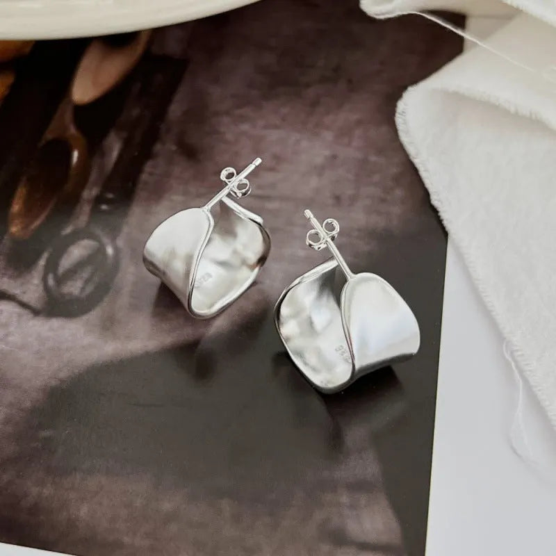 Pair of 925 silver women's ear studs with a wide irregular curved shape, 12 x 17.5mm, silver colour
