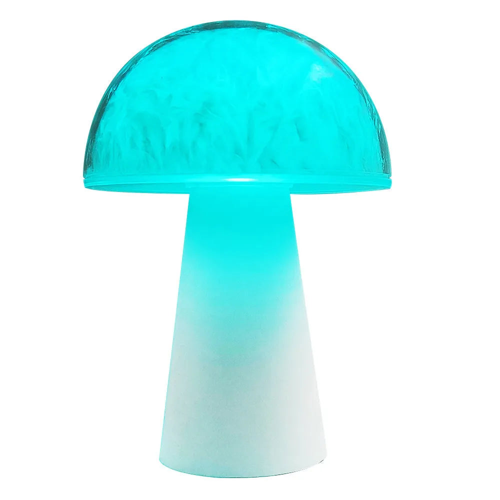 Small white mushroom-shaped night light with remote control on a wooden table.