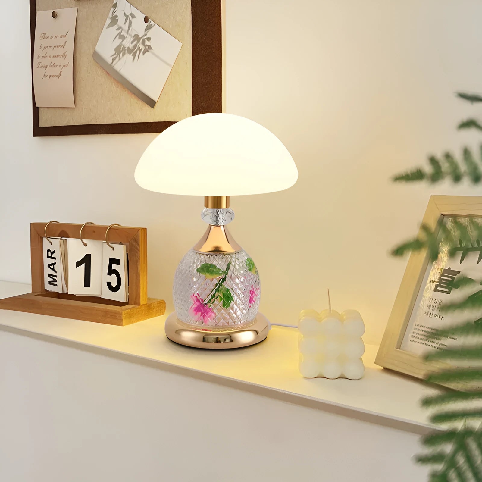 Light luxury mushroom table lamp in transparent colour option on a bedroom desk with USB cable connected.
