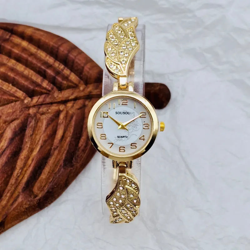Women's stainless steel watch with round dial showing gold surface option and vachette clasp