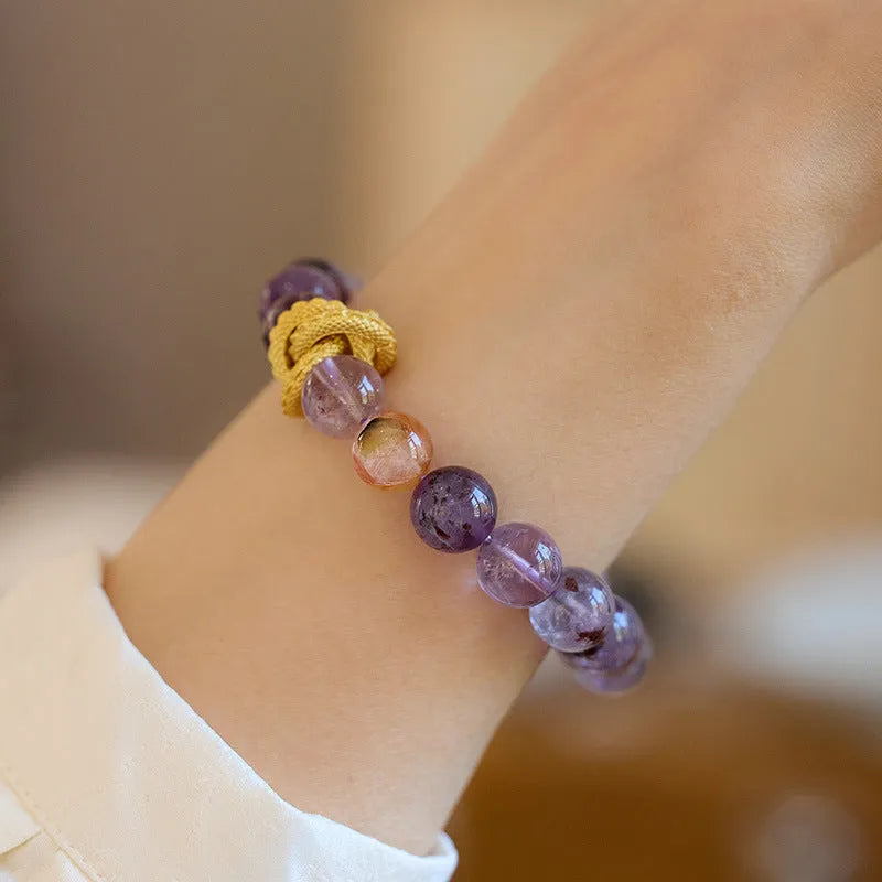 Purple ghost crystal bracelet with nine purple symbols and zodiac animal motifs measuring 10mm wide