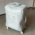 Ultra-light waterproof Oxford cloth suitcase in bluestone green with universal wheels.