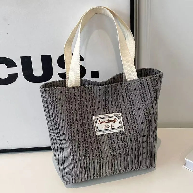 Japanese style corduroy shoulder tote handbag in dark brown colour showing textured fabric and large capacity design