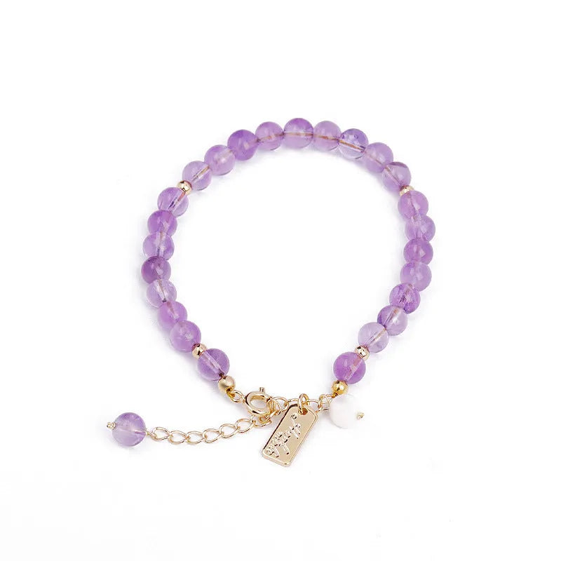 Natural crystal lavender amethyst bracelet for women in dark and light colour variations on a wrist.
