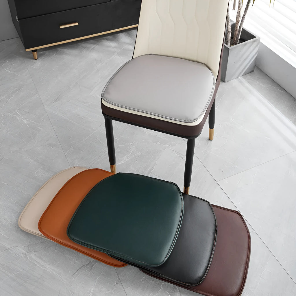 Leather horseshoe-shaped seat cushion in a solid colour on a chair, showing non-slip base.