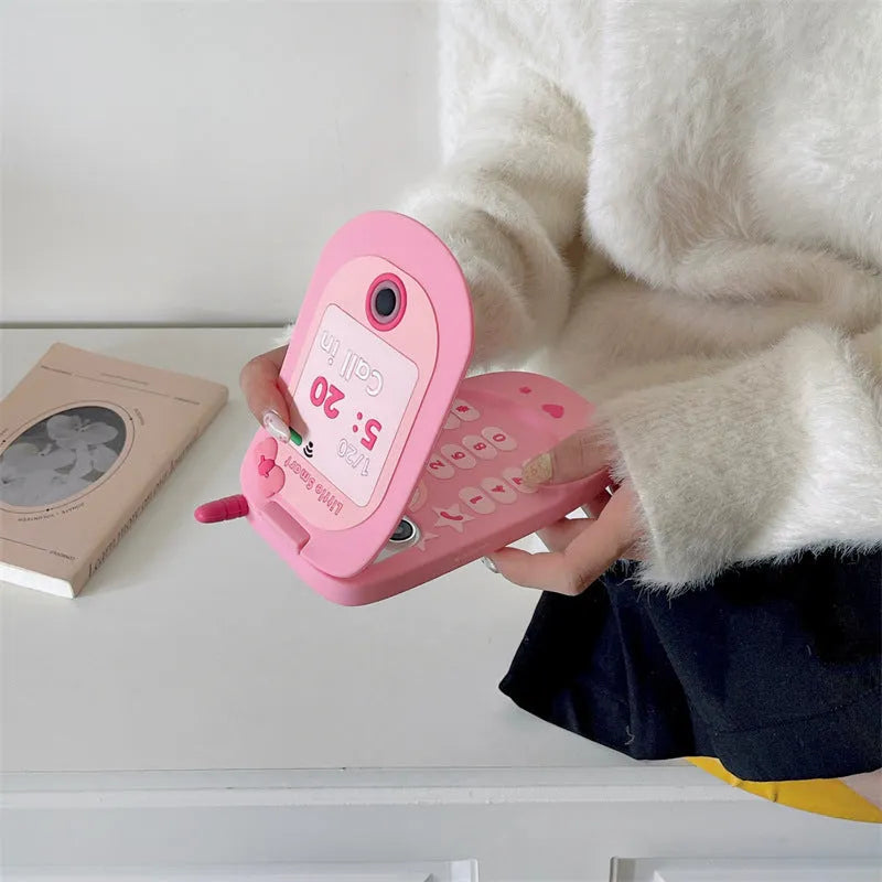Light pink silicone flip phone case with a mirror, shown next to a rose red version, for iPhone models.