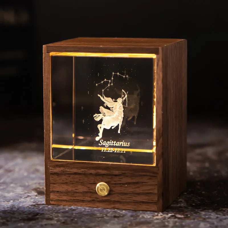 Crystal LED table lamp with black walnut base and K9 crystal showing constellation night light effect