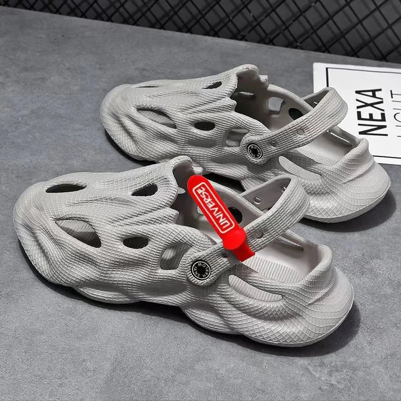 Pair of solid grey closed-toe EVA coconut slippers on a white background.