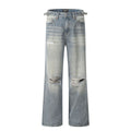 Men's blue distressed straight-leg retro jeans with a zip fly on a plain background.
