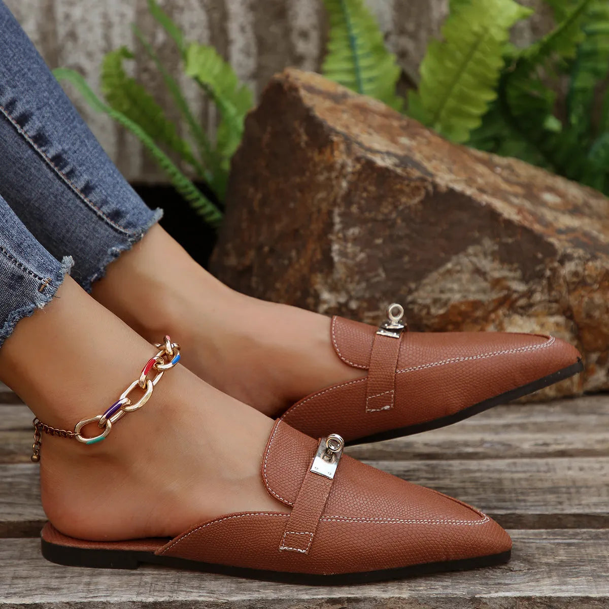 Light brown women's pointed-toe low heel casual slippers with PU upper and rubber sole.