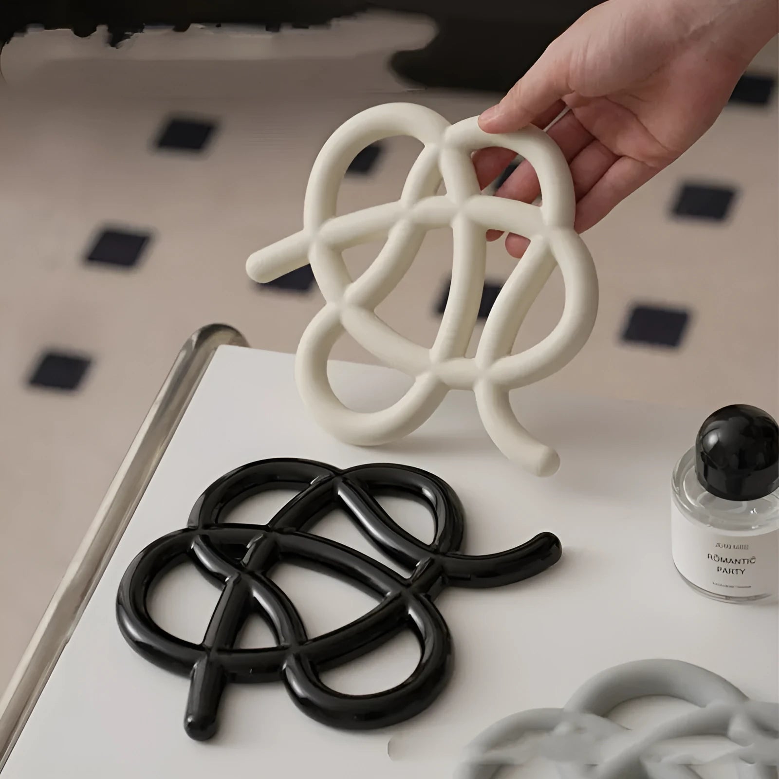 Ceramic heat proof mat with irregular modern shape in bright black, splash ink, or coconut milk grey colour