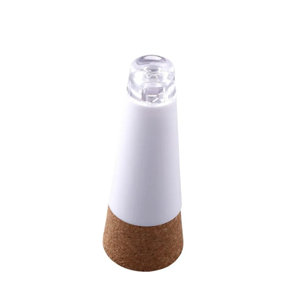 White plastic rechargeable LED bottle cap light with 15 small LED beads visible.