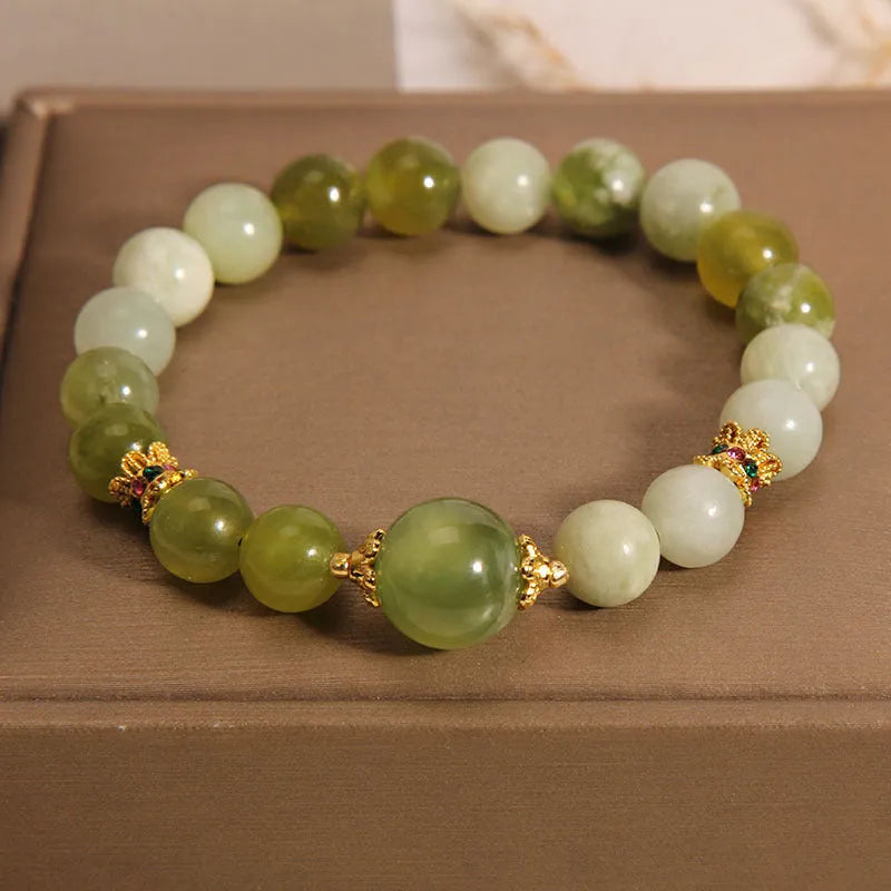 Women's Xiuyan jade bracelet in jade green with an original sweet mori style design.