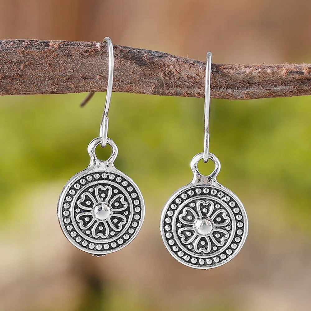 Bohemian style geometric earrings with distressed round print ethnic designs