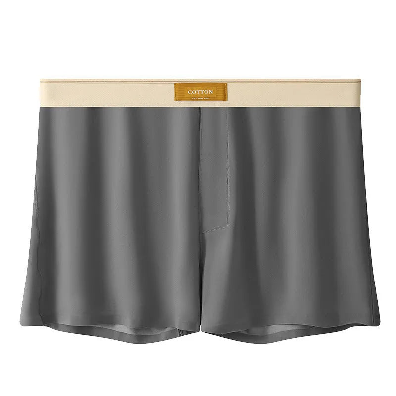 Men's solid colour loose ice silk underwear in beige apricot, laid flat.