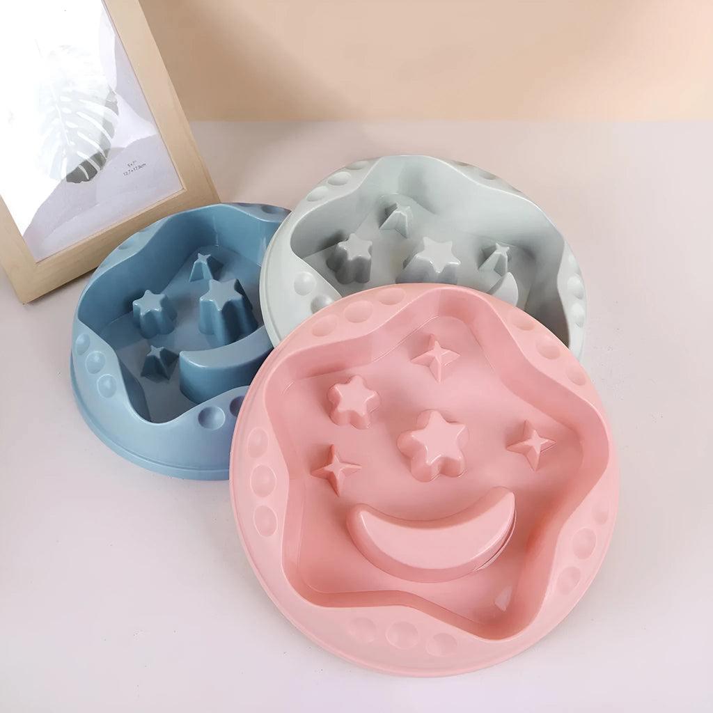 Moon Star Wings design large blue slow feeder dog bowl with raised centre on a white background