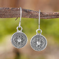 Bohemian style geometric earrings with distressed round print ethnic designs