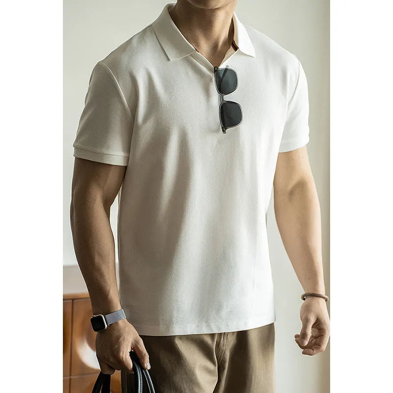 Men's blue short-sleeved cotton blend polo shirt on a hanger, showing regular fit and casual style.