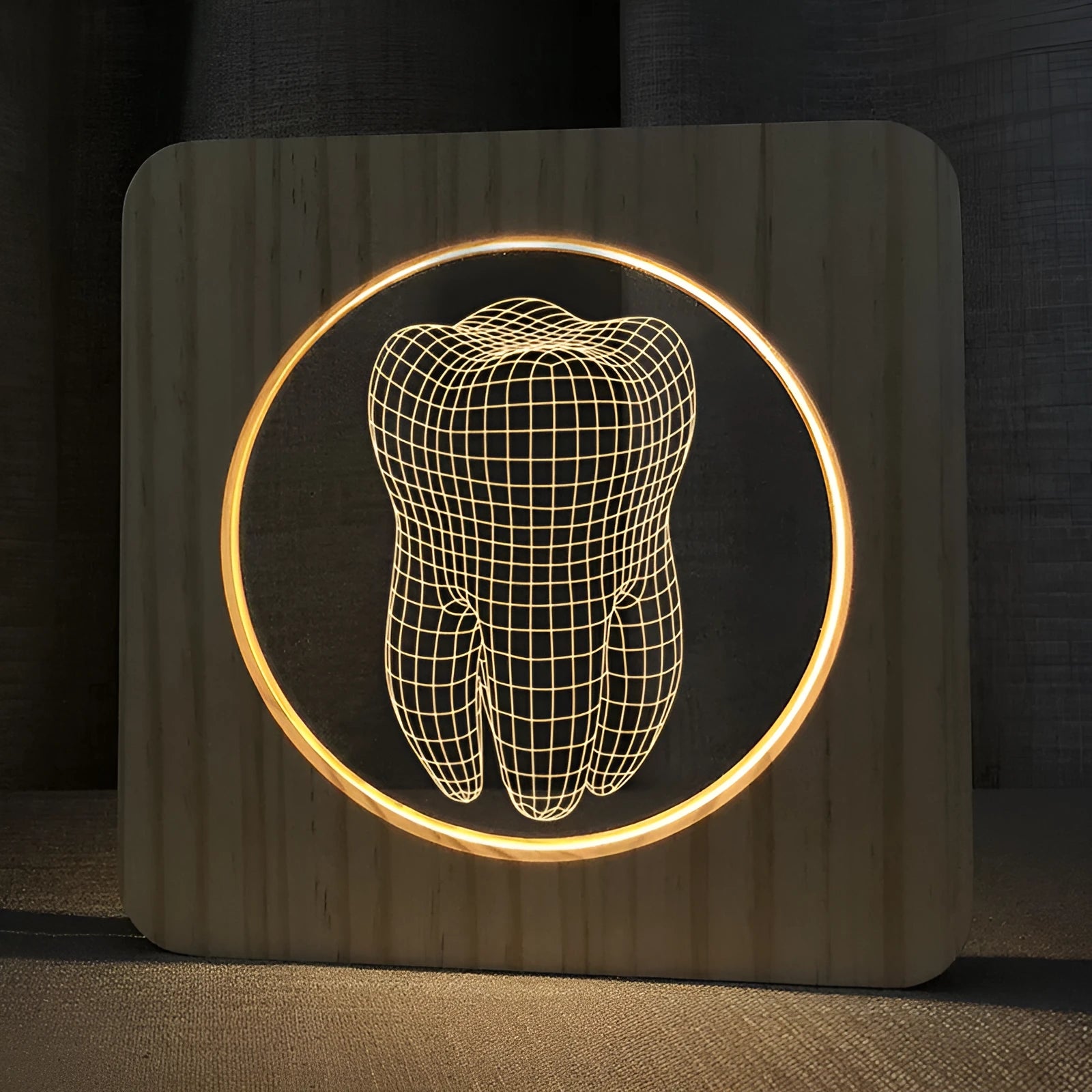 Tooth-shaped wooden-colour acrylic night lamp with USB cable on a surface.