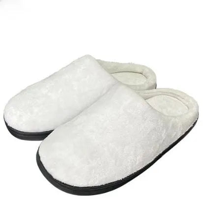 A pair of patterned cotton flannel slippers with TPR rubber soles on a wooden floor.