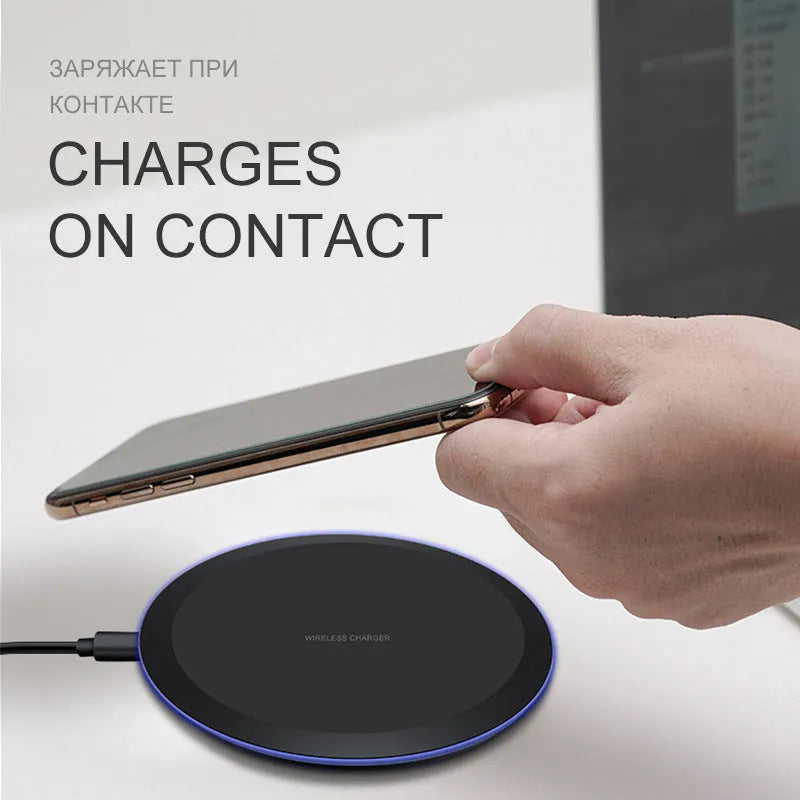 10W/5W black fast wireless phone charger pad on desk with iPhone - 100mm diameter, 8mm thick