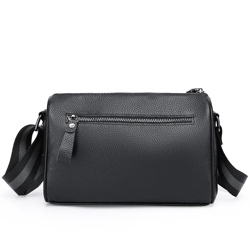 Black genuine leather women's crossbody bag showing front view and adjustable strap