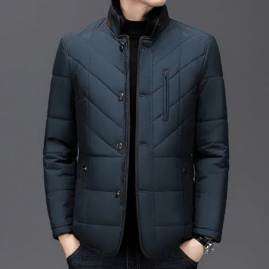 Men's dark blue winter short padded coat with side pockets on a solid background.