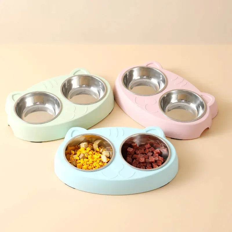 Macaron-shaped plastic pet feeder tray with two bowls in blue, green, or pink colour options