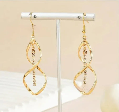Geometric spiral design earrings with electroplated gold finish and ellipse shape