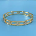 Women's simple hollow bracelet with four-leaf clover charm in gold or silver finish