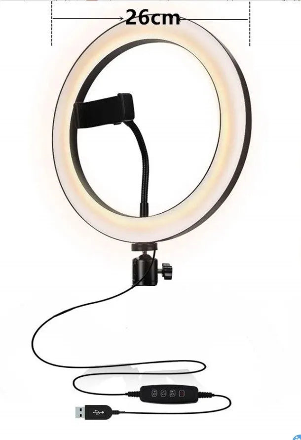 Silver adjustable tripod phone stand extended to mid-height with a ring light attachment point.