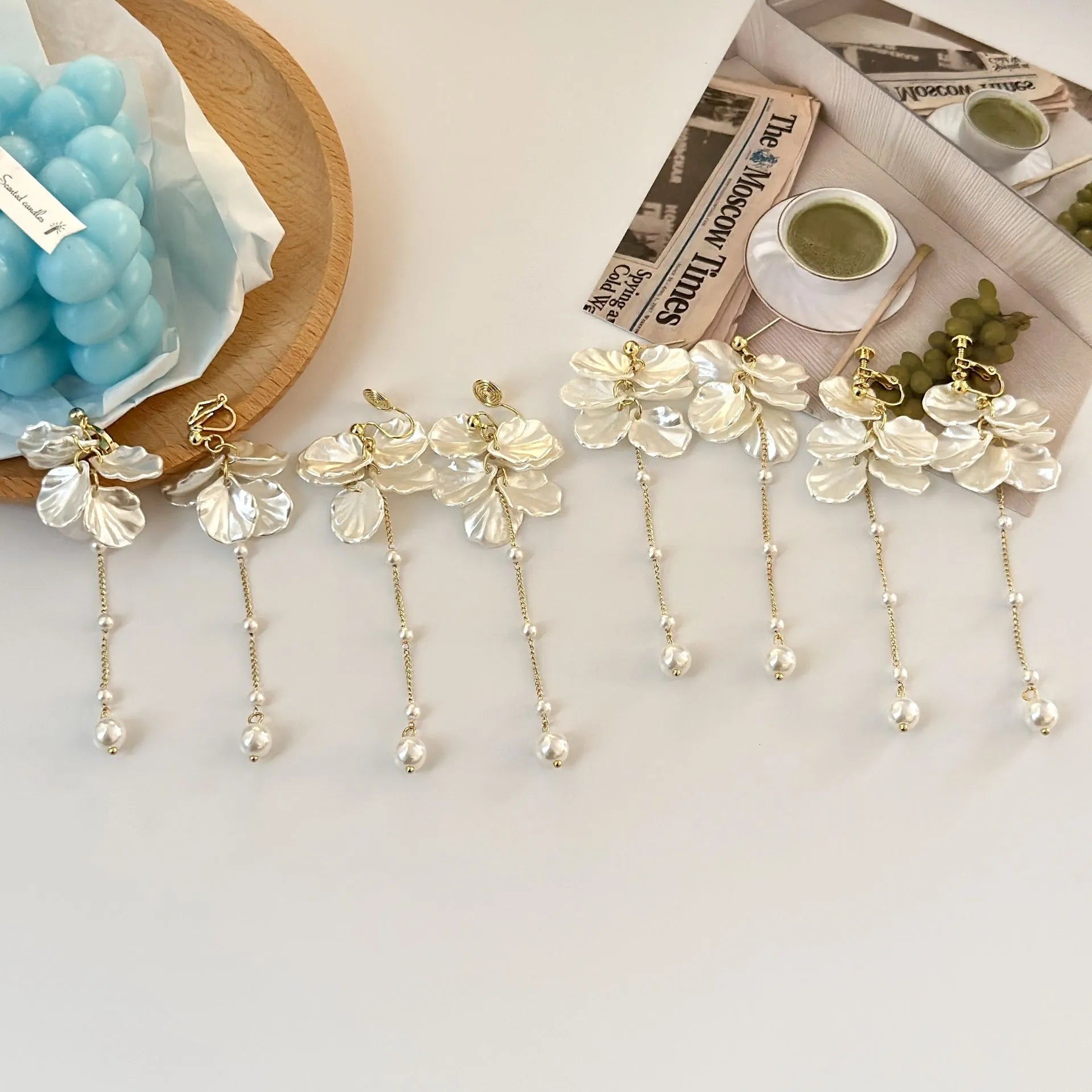Women's silver shell pearl tassel earrings showing 8.8cm length and clip options