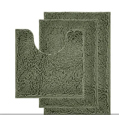 Dark green chenille three-piece U-shaped toilet mat set with non-slip TPR backing on bathroom floor.
