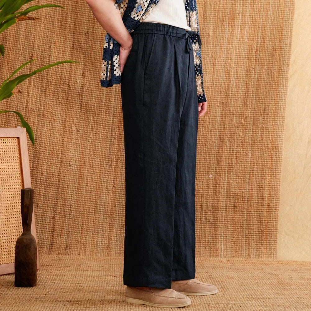 Women's high-waist linen trousers in greige colour with a straight-leg cut and elasticated waistband.