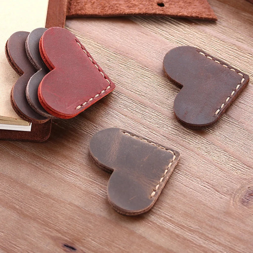 Heart-shaped bookmark in brown crazy horse leather with textured surface and handmade edges