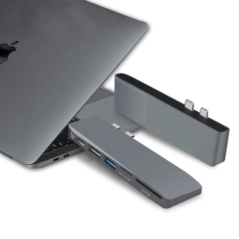 USB-C expansion adapter with eight ports for MacBook Pro showing dual connectors and multiple interface options