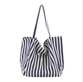 Striped canvas shoulder bag in black, blue, or red with 39cm bottom length, 35cm height, 21cm thickness, and certificate bag.