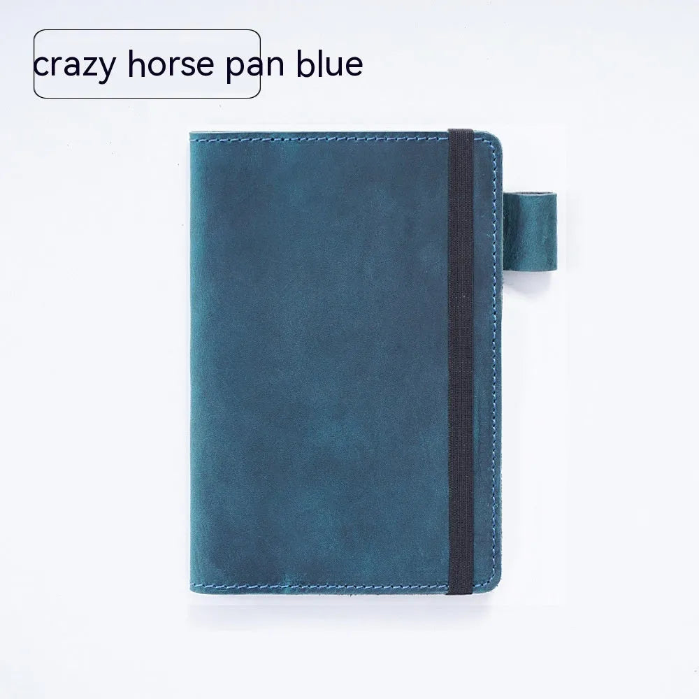 Handmade kraft notebook with cowhide cover in choice of six colours, showing open pages of wood-free paper.