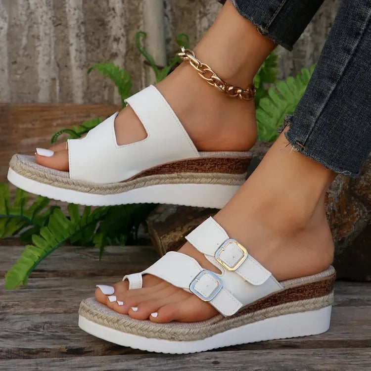 White patent leather wedge sandals with woven upper and finger fit design