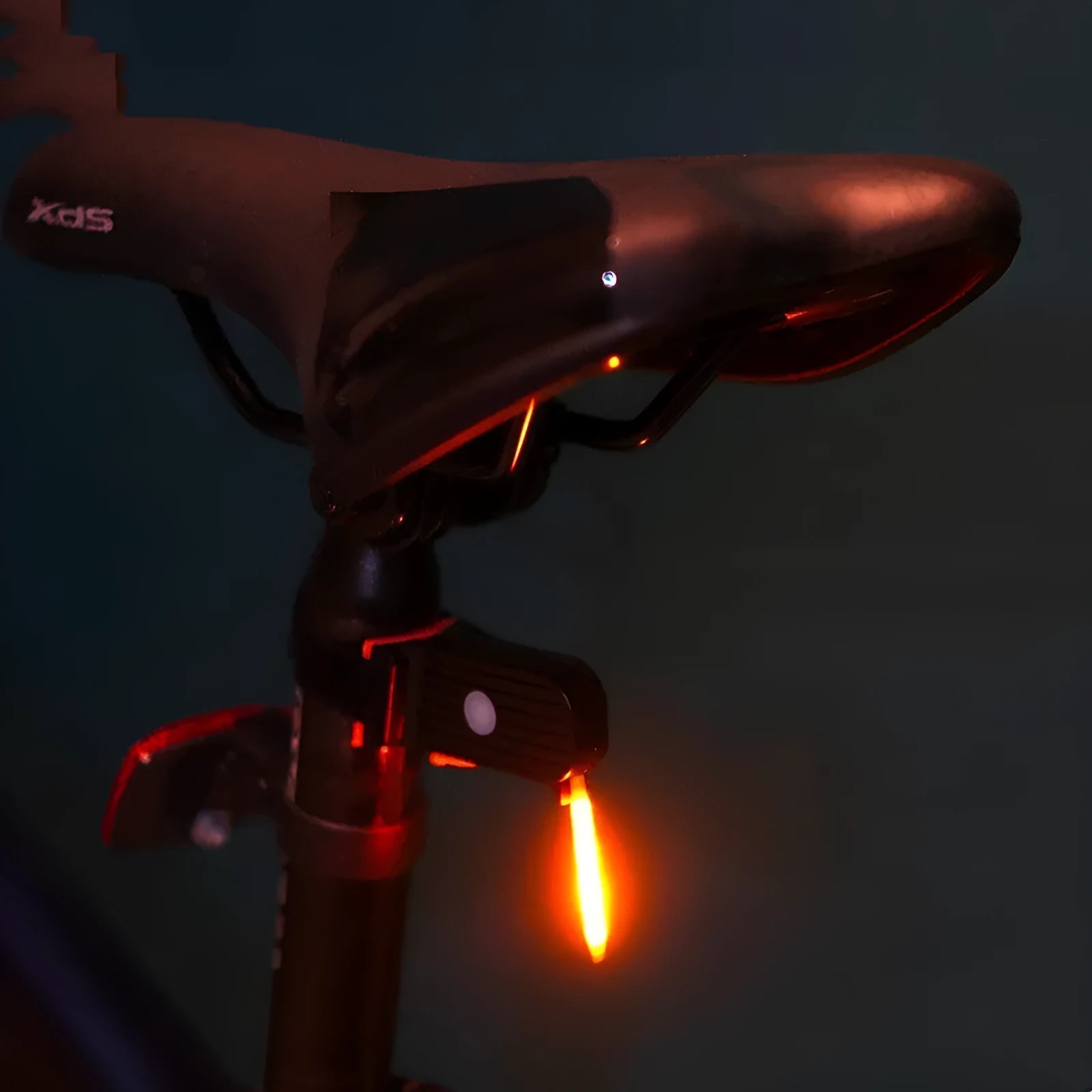 USB rechargeable waterproof bicycle rear light in yellow, red, blue, pink, or white colour options.