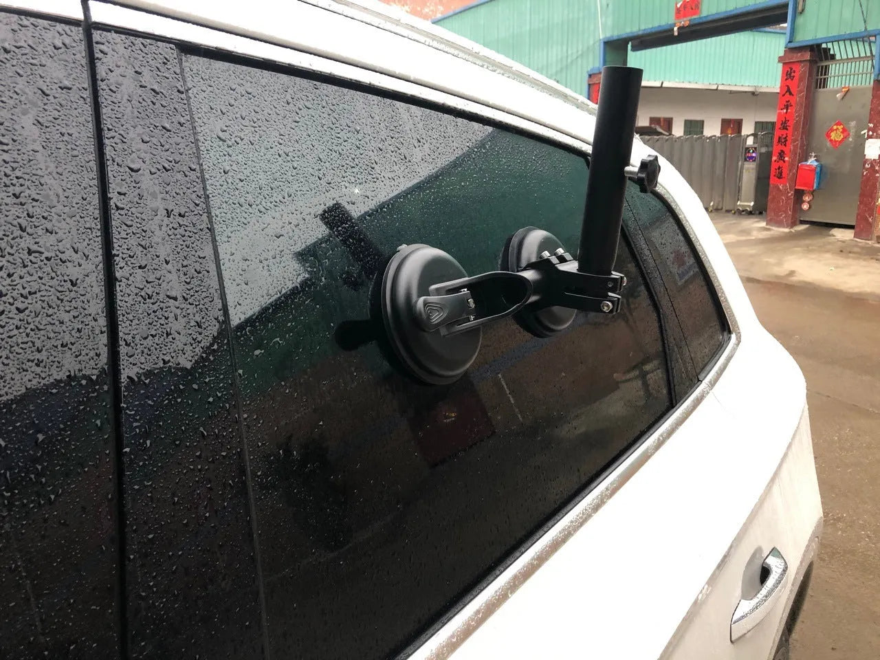 Black off-road car flagpole sucker base with round glass suction cup and rubber disc body.